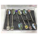 Set a six enamel spoons, depicting, famous
