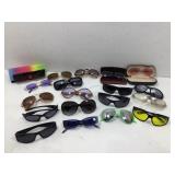 19 pair of mostly sunglasses three of them in a