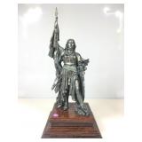 This cast metal statue depicts the French heroine