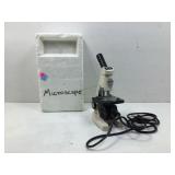 A modern microscope manufactured by TECNAR in