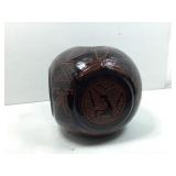 This is a vintage Navajo pottery vessel, signed