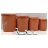 Four nesting Orange Tupperware containers with