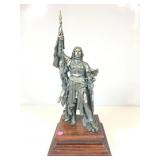 This cast metal statue depicts the French heroine