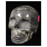 3.5in Natural Carved Stone Skull. Gray/Green Base