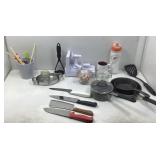 A box slot of kitchen, utensils, and appliances.