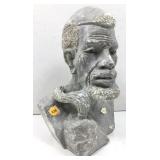 This gray concrete bust features, detailed facial