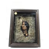 This image shows a framed shadowbox featuring a
