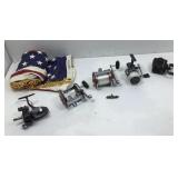 Box lot of four vintage fishing reels and a 50