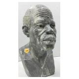 This image shows a weathered stonelike sculpture