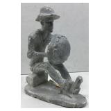 This is a gray stone carving depicting a figure