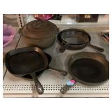Assorted Cast Iron Pans & Pots.