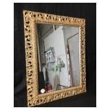 Large framed mirror in a very ornate gold