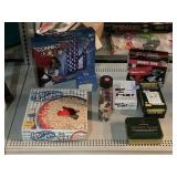 Container of Buttons, Games, and $Gun.