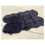 Faux Fur black rug, approx 74 in long