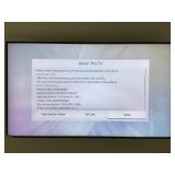 Samsung Smart 4K UHD TV, model UN75NU6900 w/wall