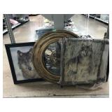 Large round plastic clock and wolf paintings