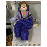 Porcelain head Clown on a swing vintage