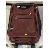 Burgundy two wheel traveling suitcase damage as