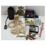 A box lot of various costume jewelry pieces, a