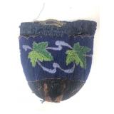 A vintage micro beaded reticule handbag features