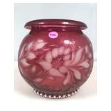 A vintage cranberry glass rose bowl vase