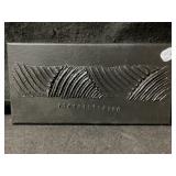 This piece is a black rectangular wall art panel