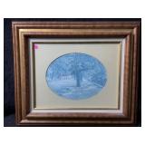 This is a framed oval print called Main Street by