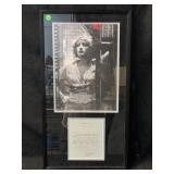 A large black and white photo of actress Joan