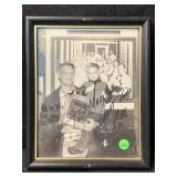 Framed black-and-white autographed photograph of