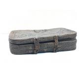 A vintage tightly woven rattan storage box