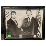 Black and white photo of a man shaking hands with