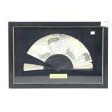 An antique folding hand fan likely from the late