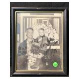 Framed black-and-white autographed photograph of