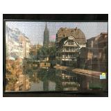 A framed vintage jigsaw puzzle featuring the