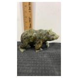 Hand carved stone bear sculpture likely made from