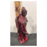Hand carved 9.5" Red resin statue depicting