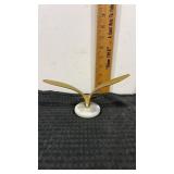 Flying solid brass  seagull bird on a white