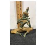 Oriental solid metal figure  playing flute  green