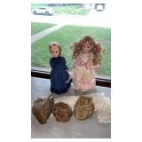 2 dolls on stands and more