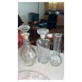 Clear glass decanters with stoppers and 1 vase