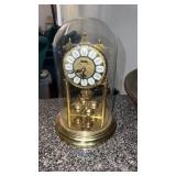 Table top clock in glass dome