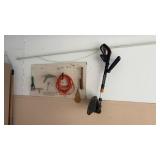 Pegboard of extension cord gardening tools and