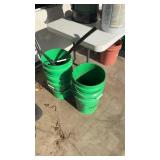 Five Menards buckets empty one with just scrap