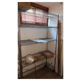 Metal rolling rack on wheels. . approximately  76