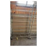 Metal shelving unit on rollers
