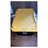 Black tote with yellow lid and contents