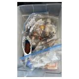 Small tote with lid and fishing hooks, lures,