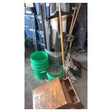 Metal garbage can , wooden table top desk and