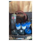 Propane bottles and acetylene bottle with hoses.
