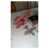 2 decorative wooden airplanes , cell phones and